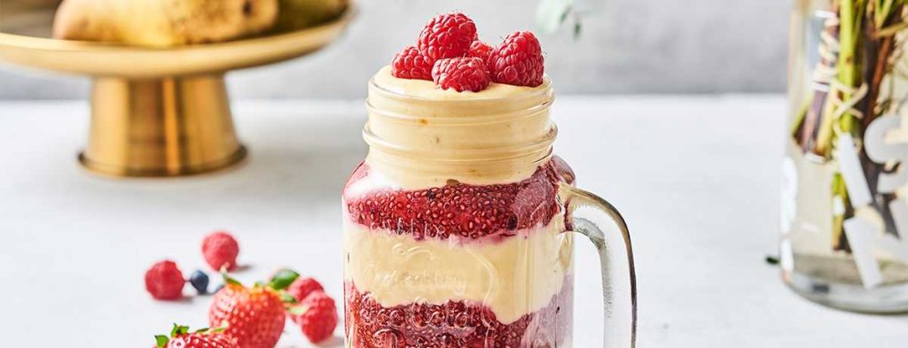 A layered vanilla raspberry shake