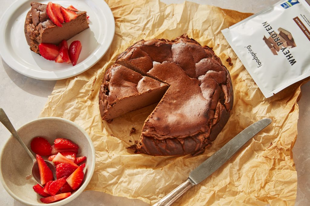High protein baked chocolate cheesecake with strawberries