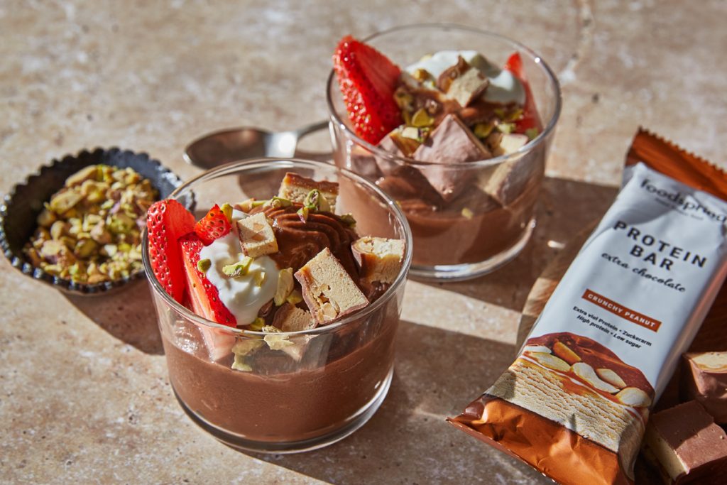 healthy chocolate sweet potato ice cream sundae with protein bars and strawberries